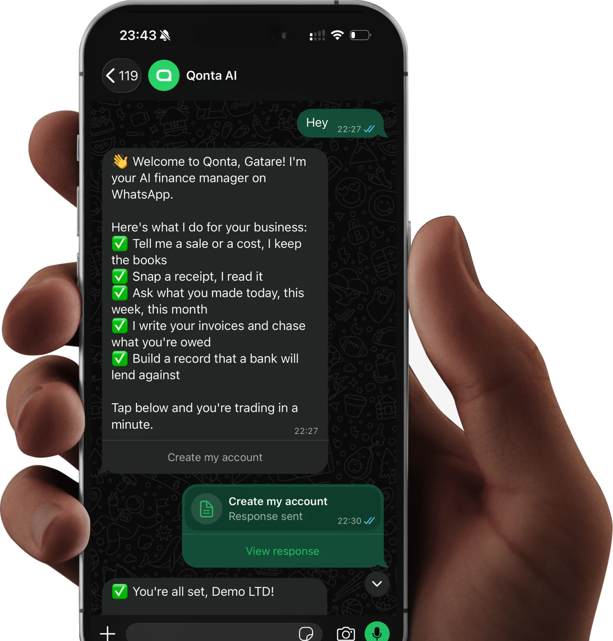 A hand holding a phone with the Qonta chat open on WhatsApp